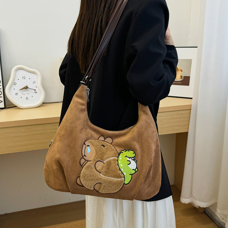 Shoulder bag with playful bear motif