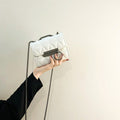 Women's clutch bag with elegant quilting and fine chain strap