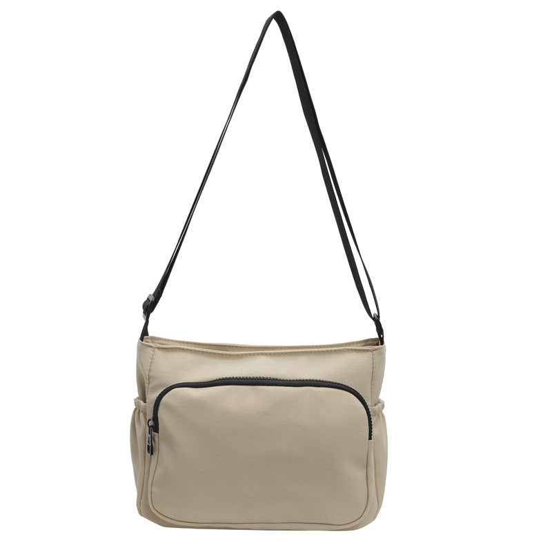 Practical shoulder bag with versatile storage compartments