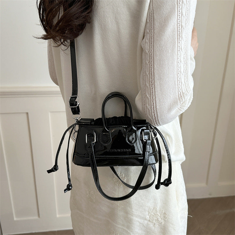 Women's mini bag with playful drawstring and shiny finish