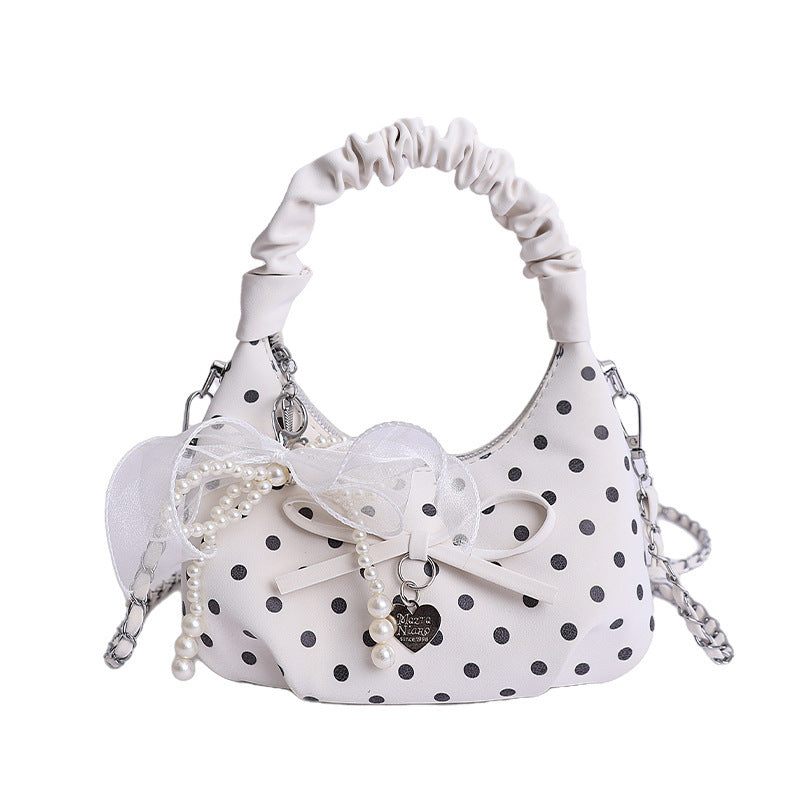 Women's mini handbag with decorative accents