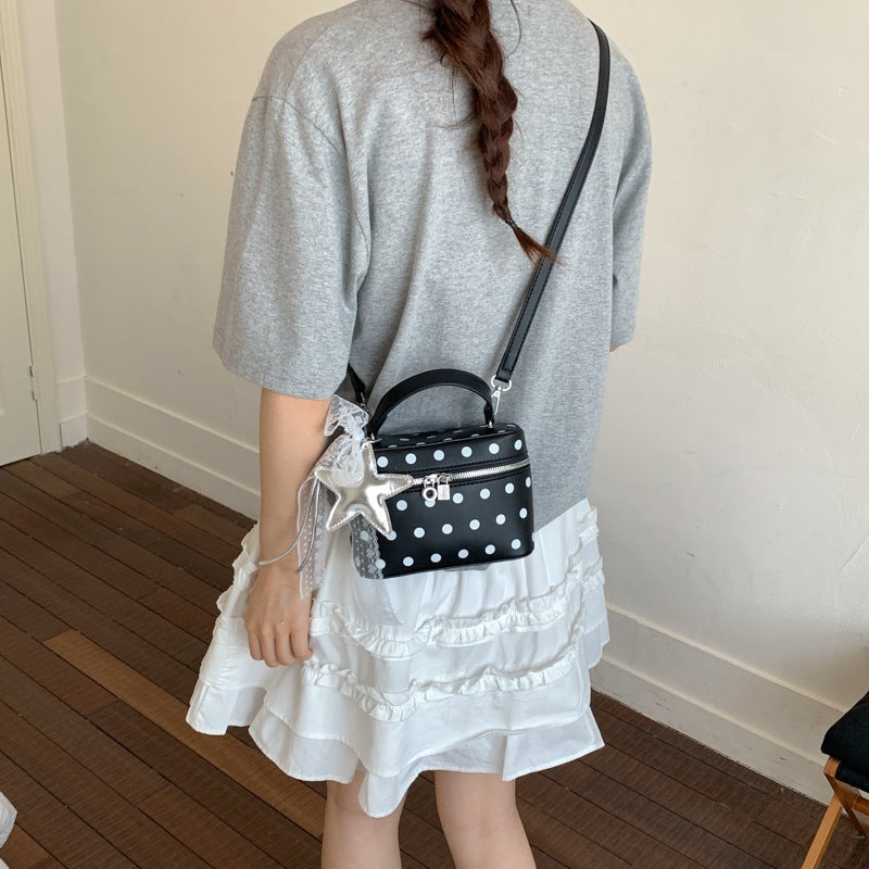 Women's mini handbag with playful design and elegant accents