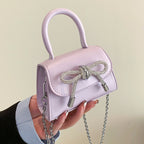 Women’s mini handbag with elegant chain closure