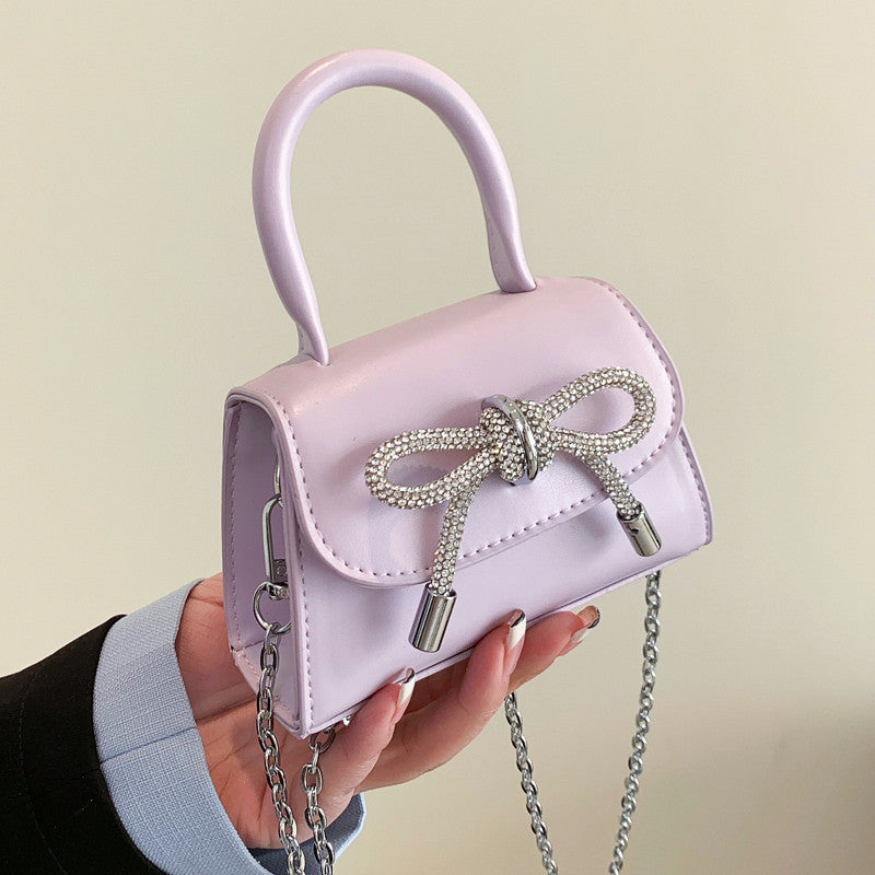 Women’s mini handbag with elegant chain closure