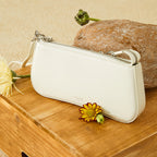 Women's elegant shoulder bag with chain accent