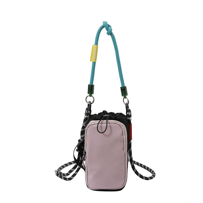Women's multifunctional mini crossbody bag made of durable material with adjustable shoulder strap