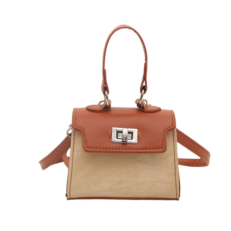 Ladies mini handbag with luxurious leather look and practical carrying handles