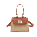Ladies mini handbag with luxurious leather look and practical carrying handles
