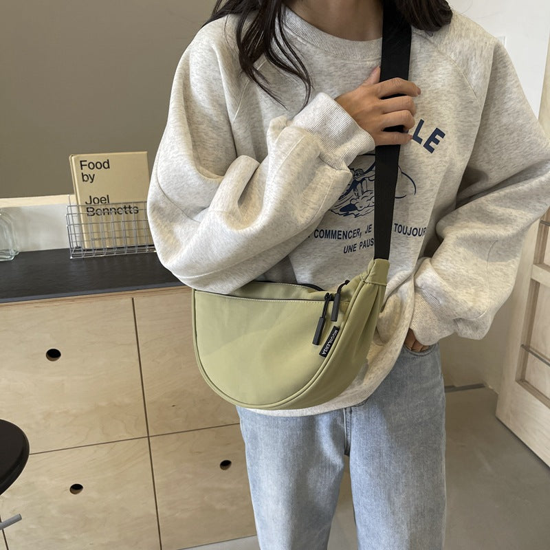 Shoulder bag with adjustable strap and multiple compartments