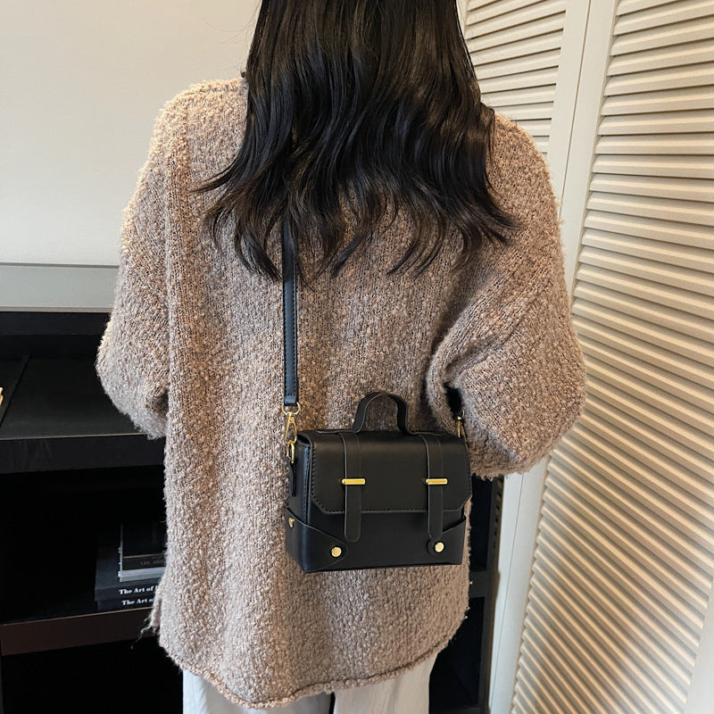 Women's mini handbag with textured design and detachable shoulder strap
