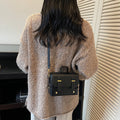Women's mini handbag with textured design and detachable shoulder strap