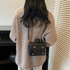 Women's mini handbag with textured design and detachable shoulder strap