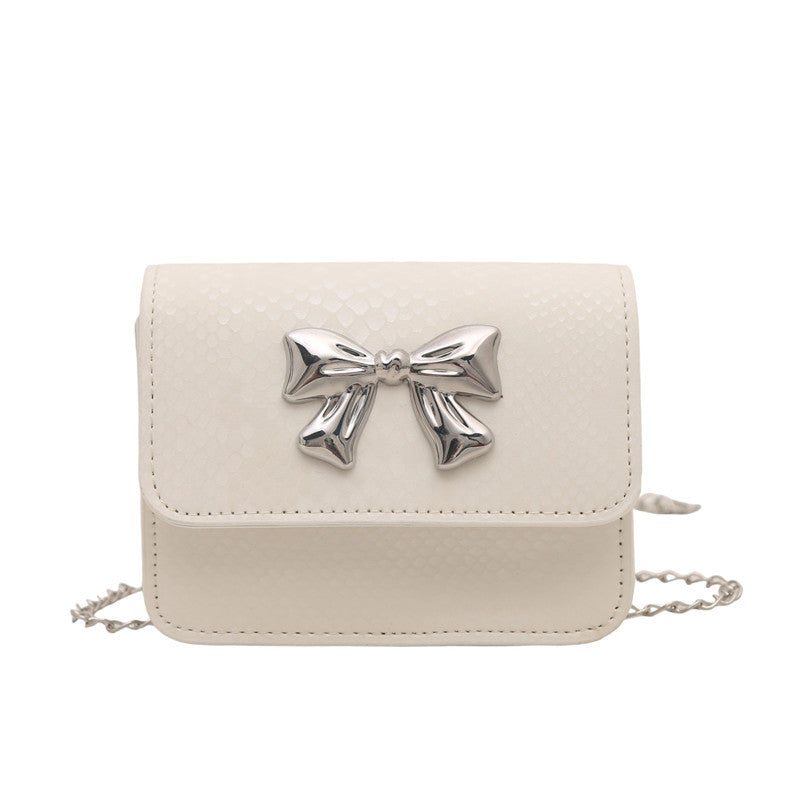 Women's clutch with playful bow design