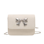 Women's clutch with playful bow design