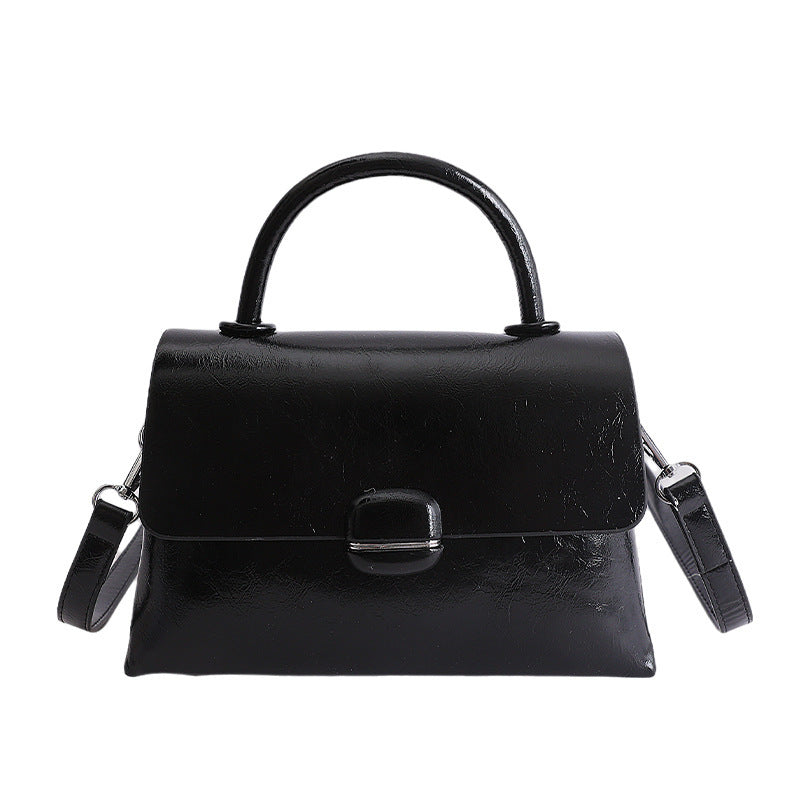 Women's handbag with textured design and elegant closure