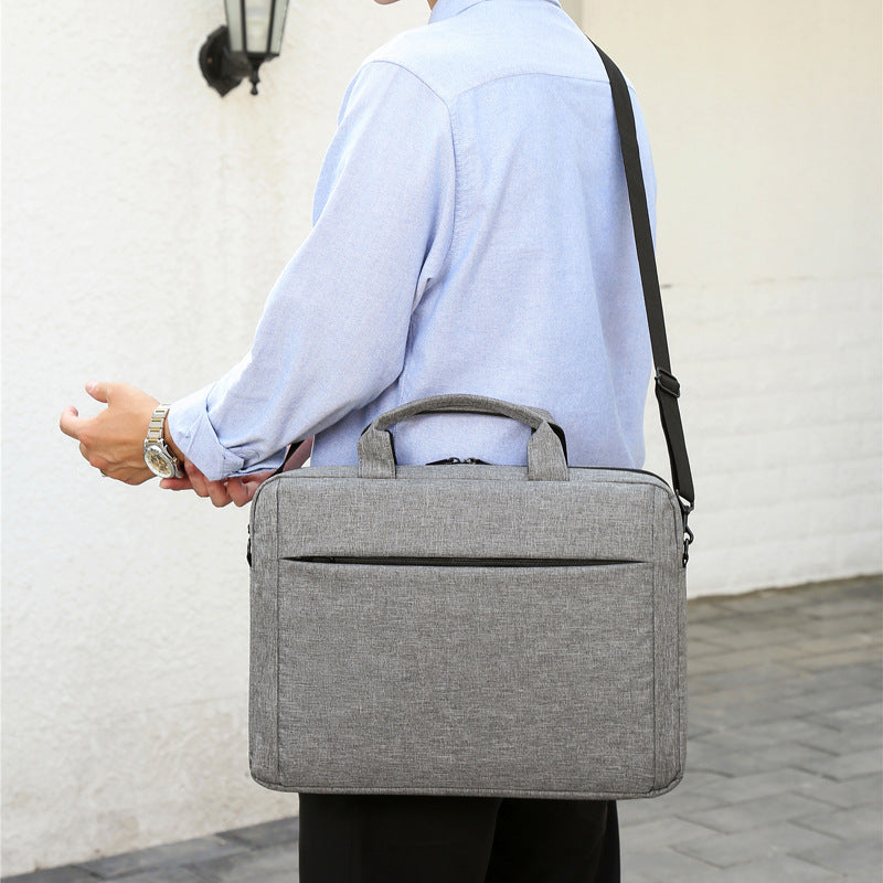 Laptop bag with secure zipper compartment and practical carrying options