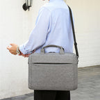 Laptop bag with secure zipper compartment and practical carrying options