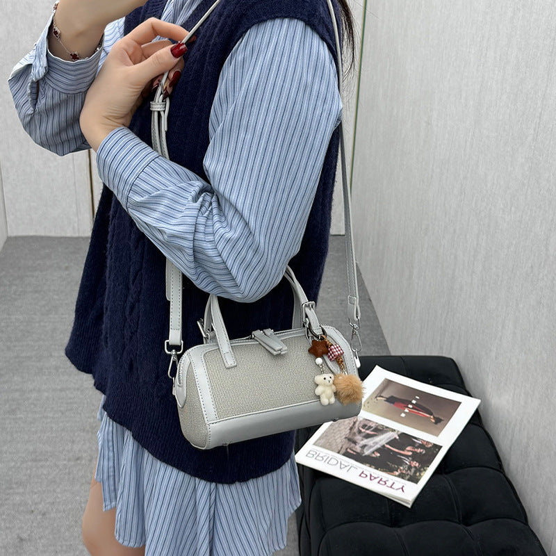 Women's mini bag with playful charm