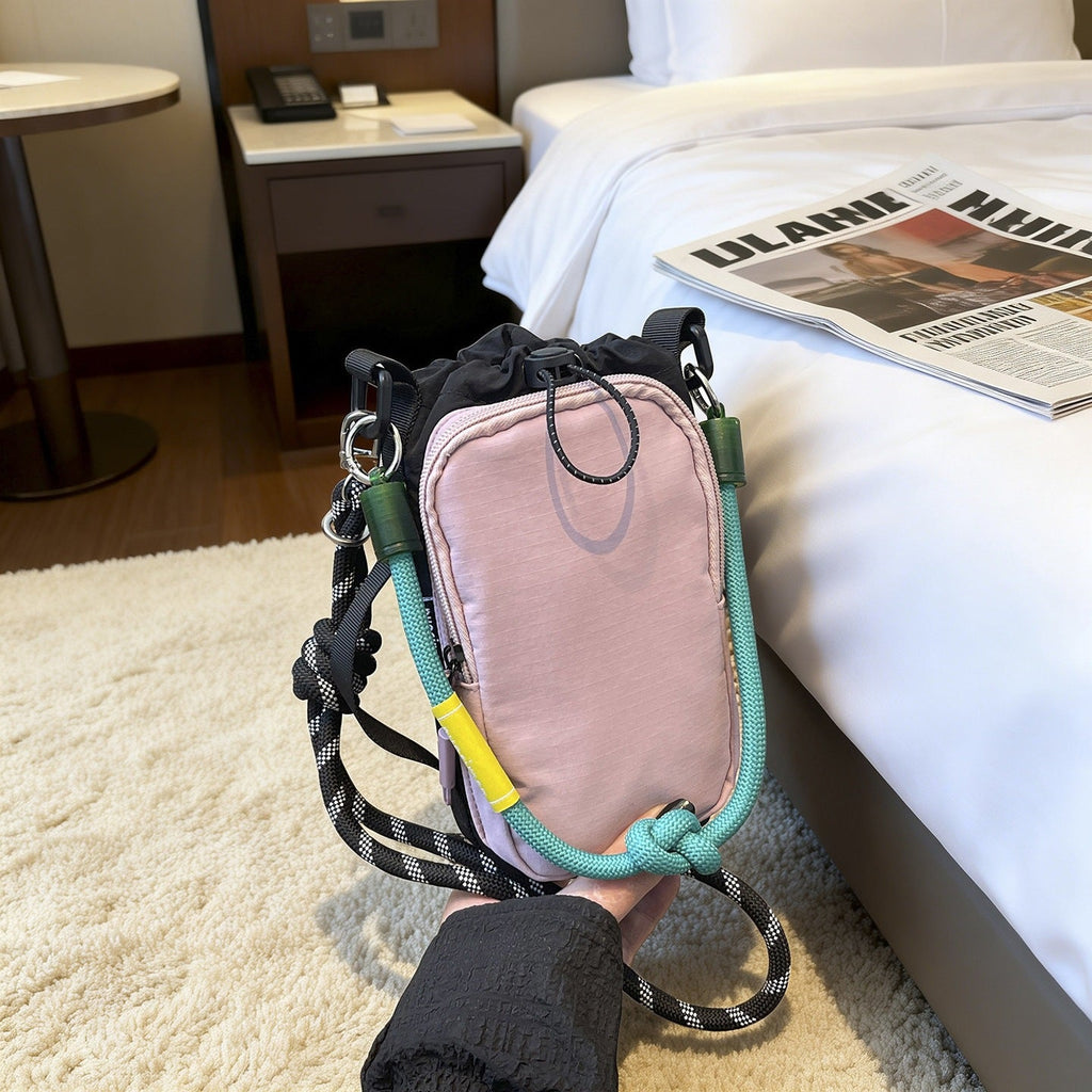 Women's multifunctional mini crossbody bag made of durable material with adjustable shoulder strap
