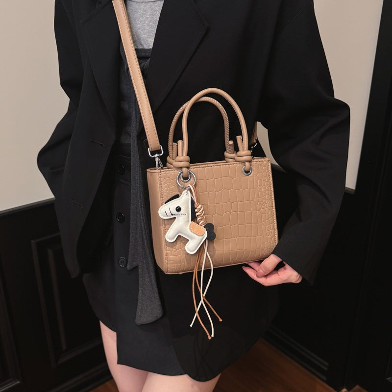 Women's mini bag with animal charm and modern crocodile look