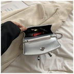 Ladies mini handbag with luxurious quilted pattern and sparkling chain pendant