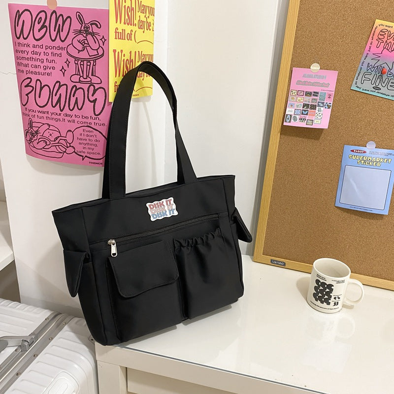 Tote bag with versatile compartments and ergonomic design