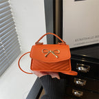 Women’s mini handbag with elegant bow decoration