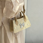 Ladies mini bag with floral woven design and stylish bow detail