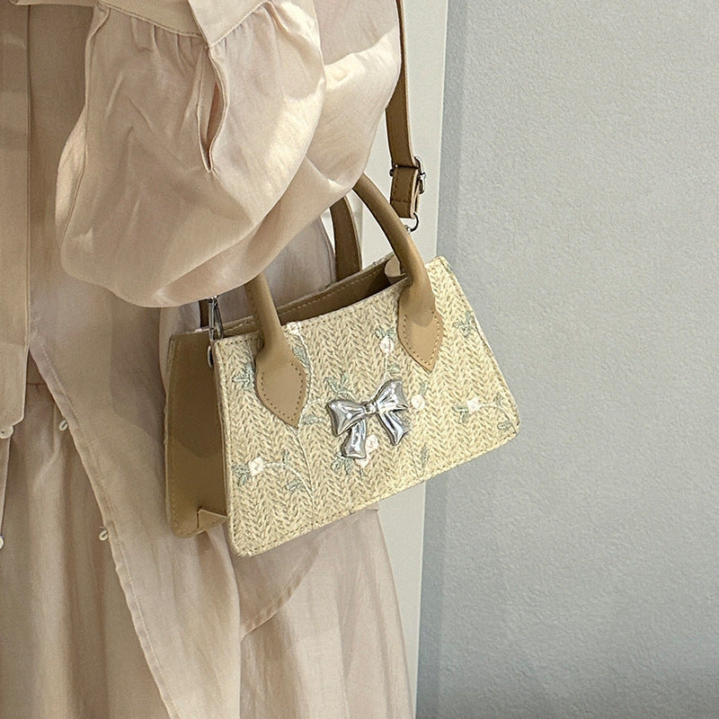 Ladies mini bag with floral woven design and stylish bow detail