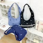 Comfortable shoulder bag with original embroidery motif