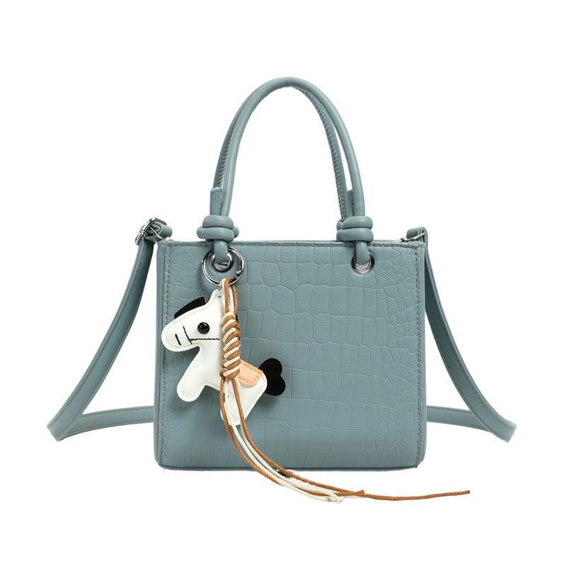 Women's mini bag with animal charm and modern crocodile look