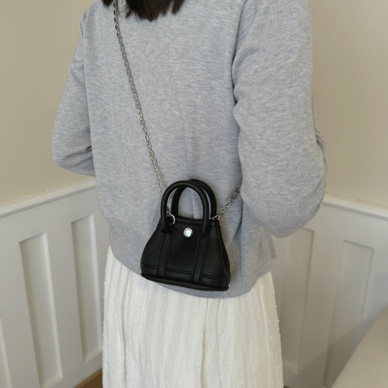 Ladies mini handbag with smooth structure and removable chain strap