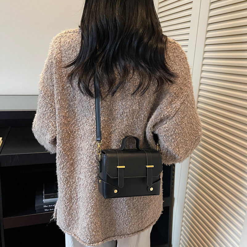 Women's mini handbag with textured design and detachable shoulder strap
