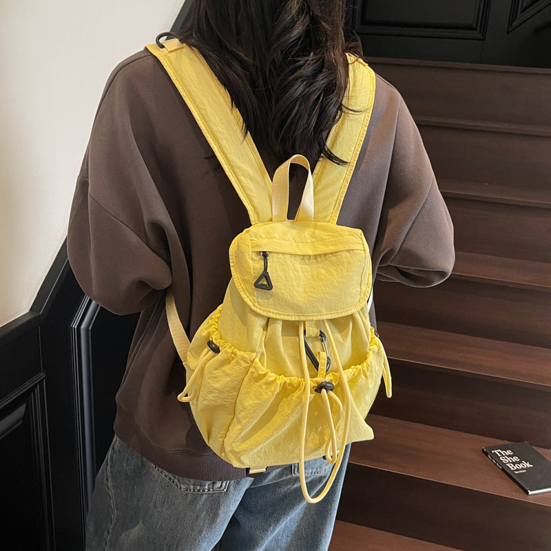 Leisure backpack with elastic drawstring and practical side pockets