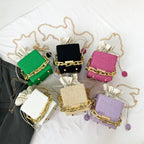 Women's mini handbag with unique chain embellishment and classic drawstring