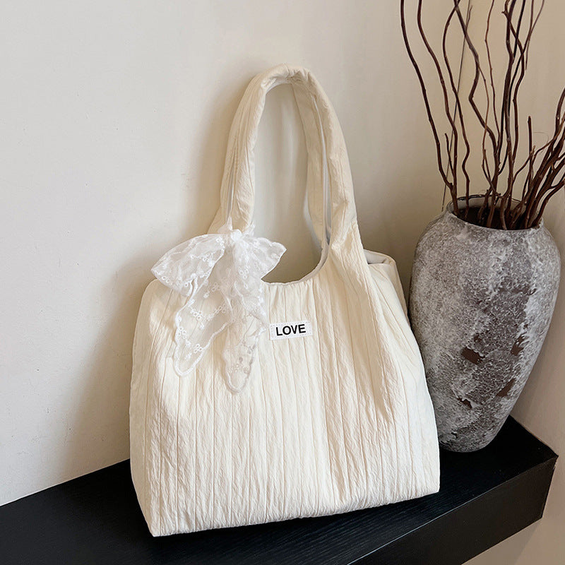 Leisure bag with structured design and playful scarf