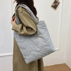 Padded shoulder bag with wave design