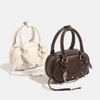 Women's mini handbag with playful drawstring and elegant accents