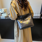 Shoulder bag with charming applications