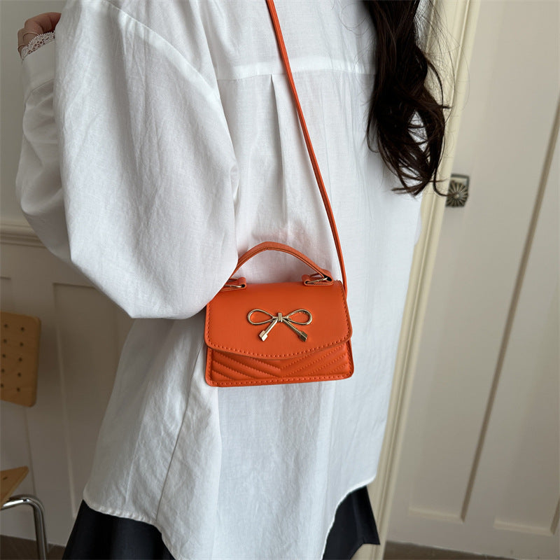 Women’s mini handbag with elegant bow decoration