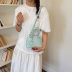 Women’s mini handbag with playful polka dot pattern and detachable shoulder strap