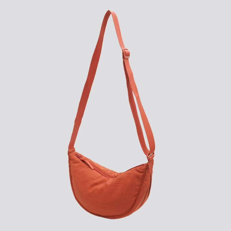 Shoulder bag with practical compartment system and adjustable shoulder strap