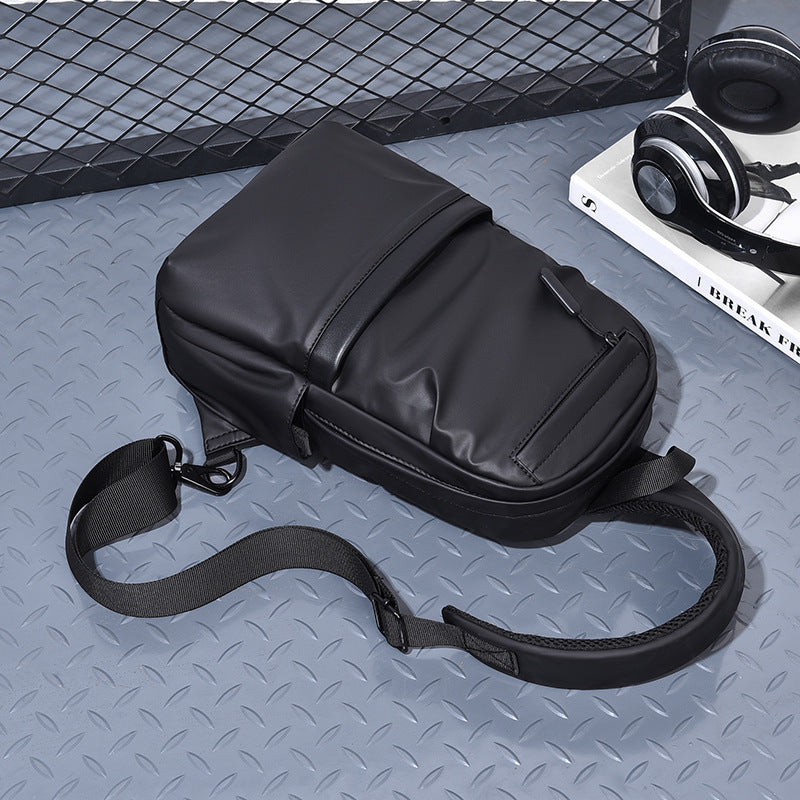 Compact sling backpack with multifunctional storage compartments
