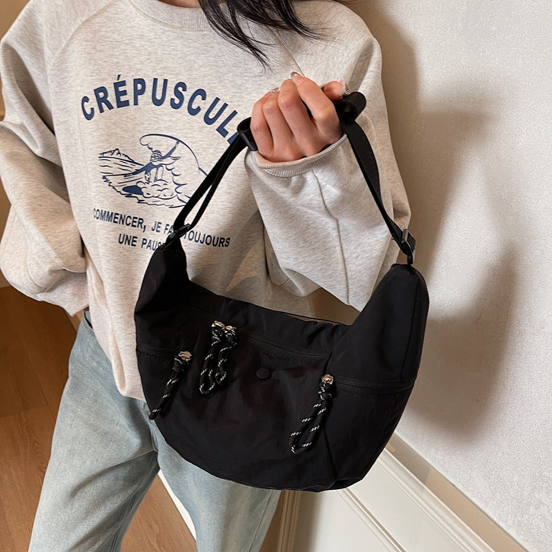 Practical shoulder bag with external zip pockets