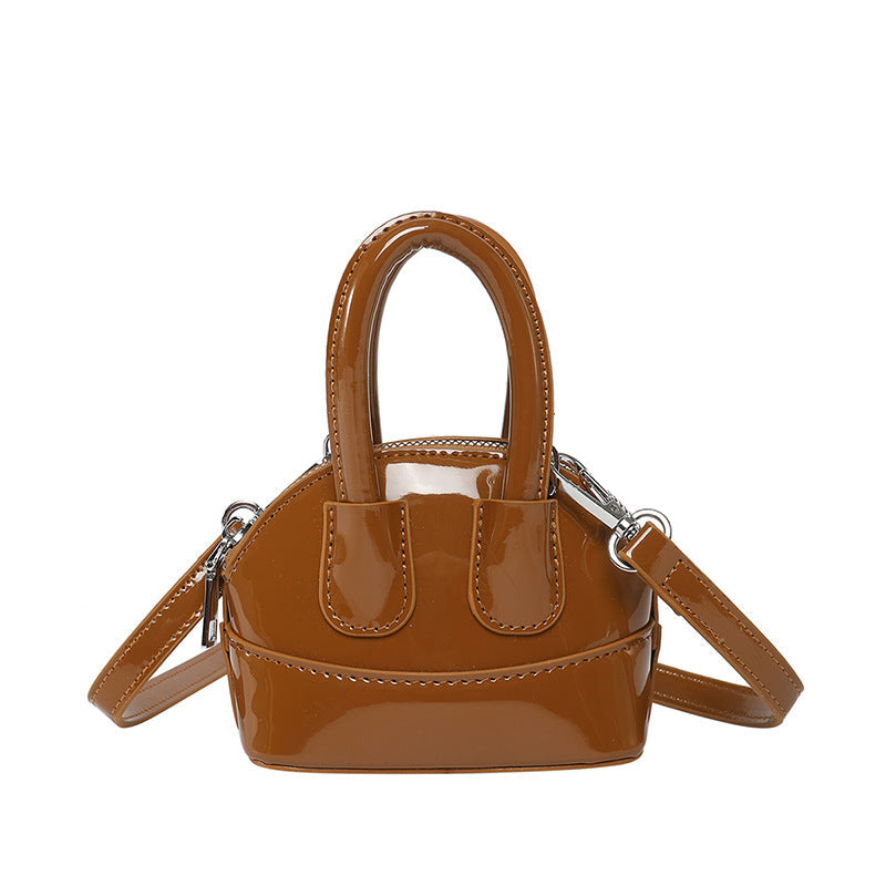 Ladies mini handbag with elegant glossy finish and removable shoulder strap
