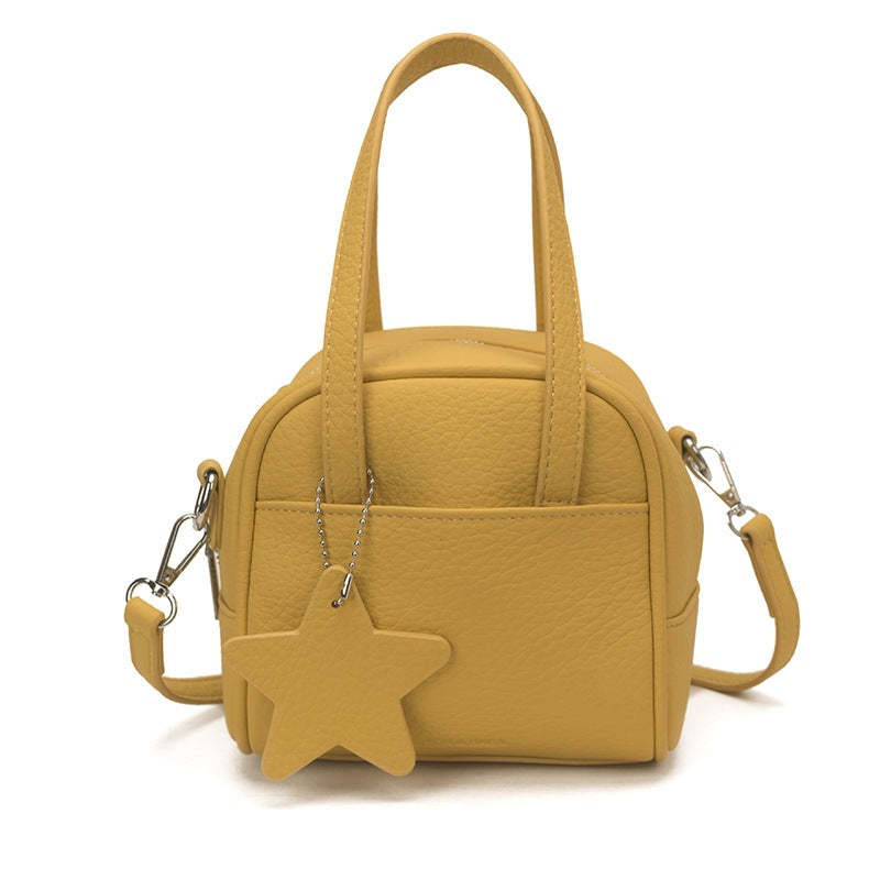 Ladies mini bag with decorative pendant