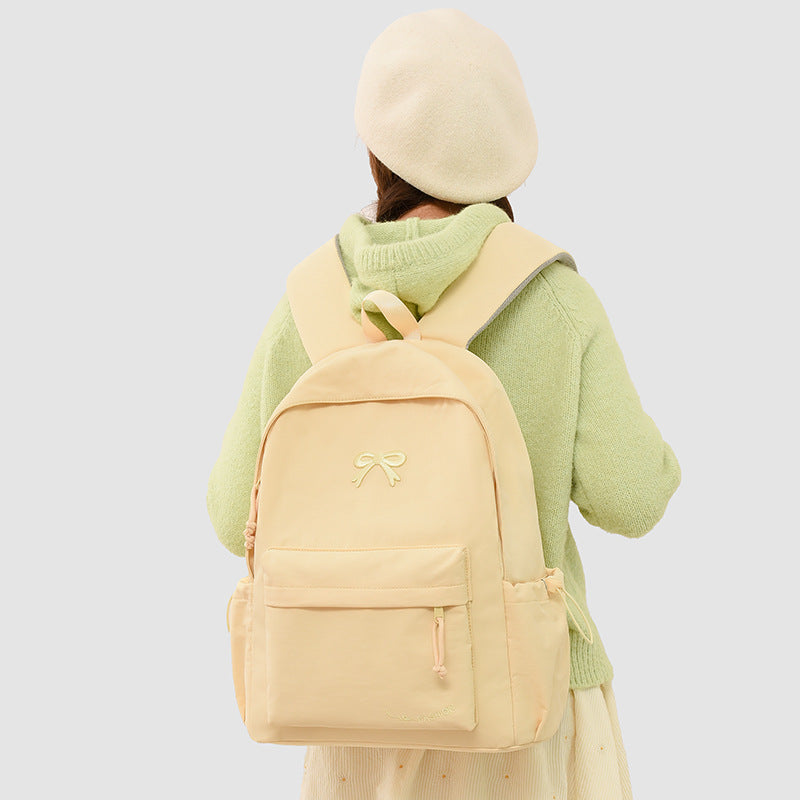 Fashionable backpack with practical outer pockets