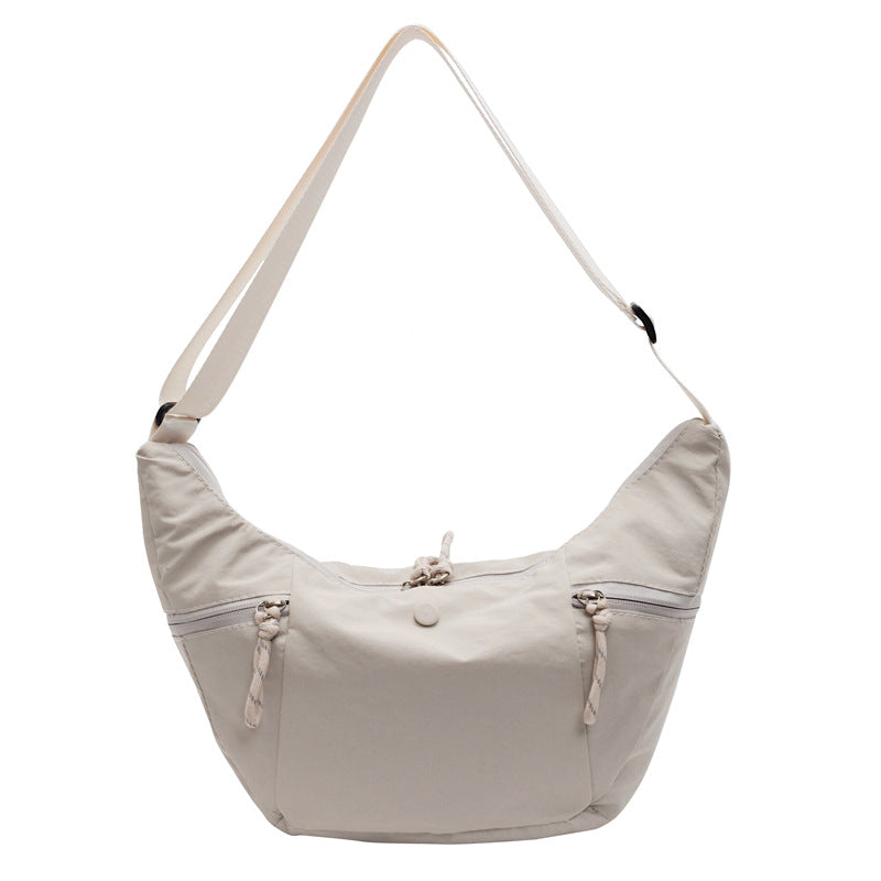 Practical shoulder bag with external zip pockets