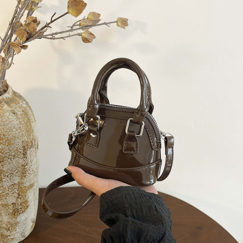 Women's mini handbag with glossy surface and fashionable zipper