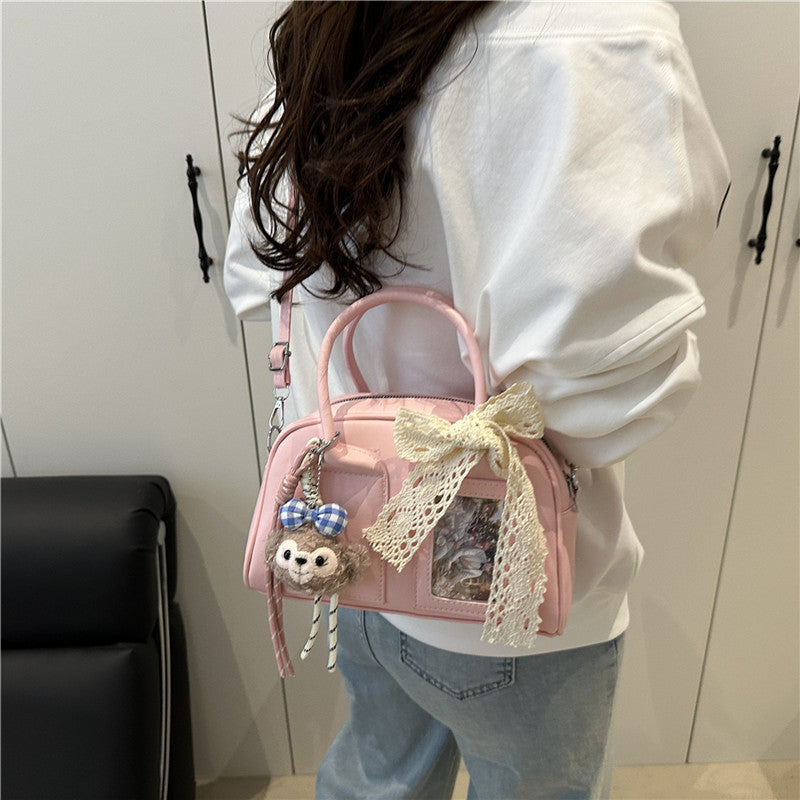 Ladies Mini Handbag with playful animal motif and charming charm